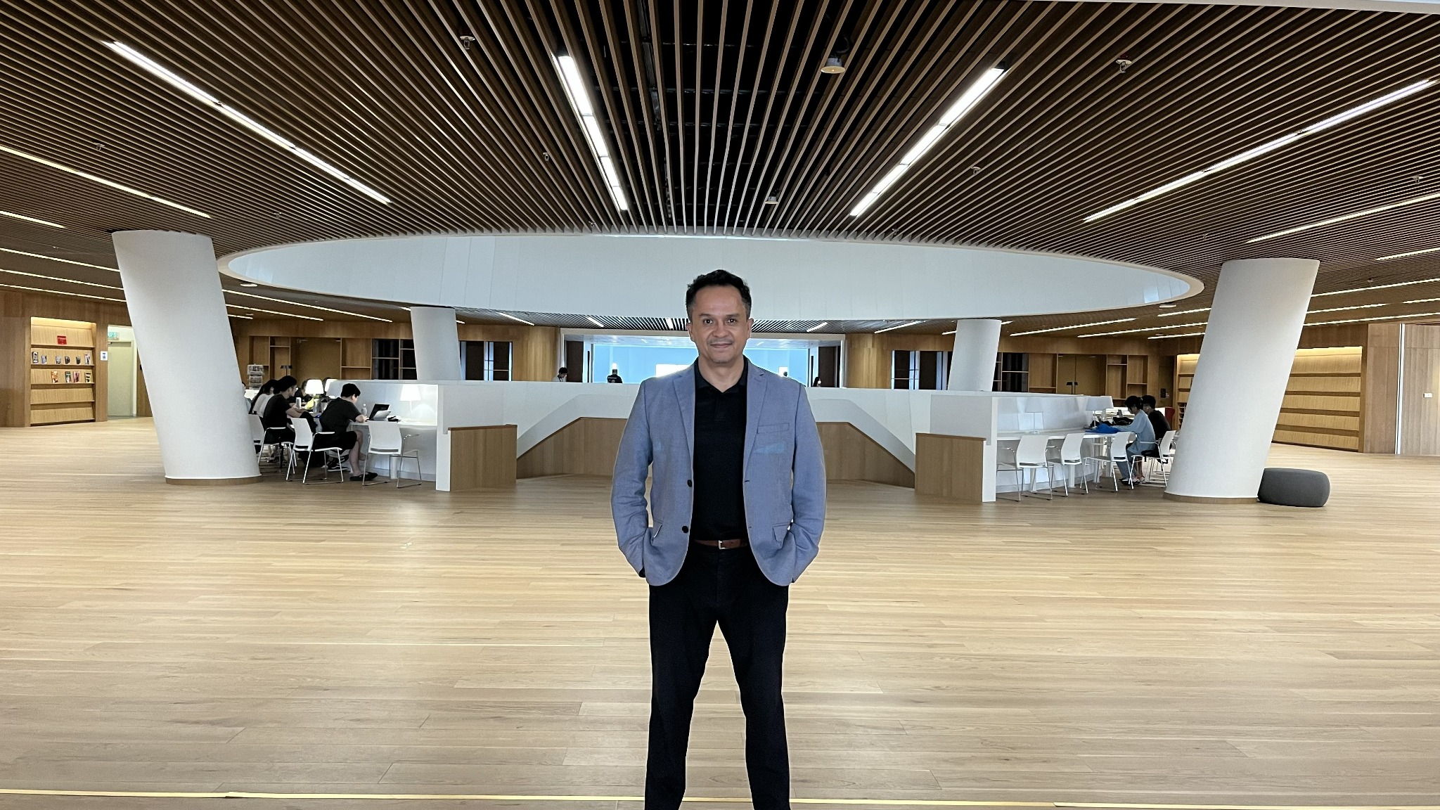 Luis M. Pazos at a university library